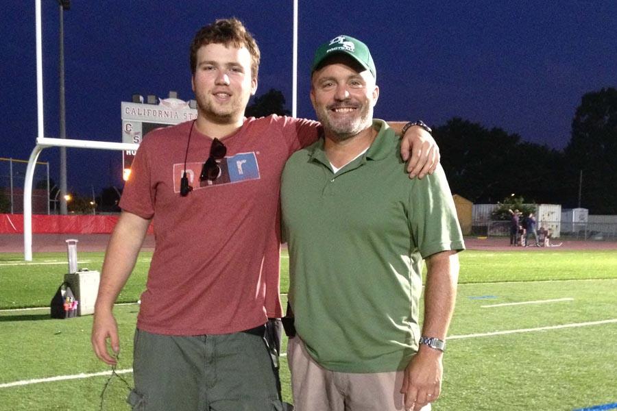 Neil Hayes (right), author of "When the Game Stands Tall," with son Nick (left). Hayes' book has been adapted into a film of the same name, in theaters now.