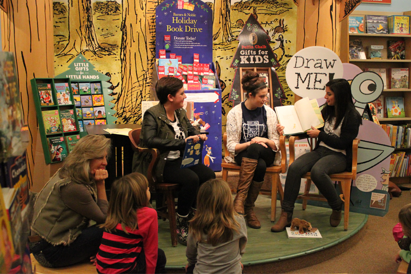 Members of Theatre Central read books aloud to visitors in the childrens section of Barnes & Noble.