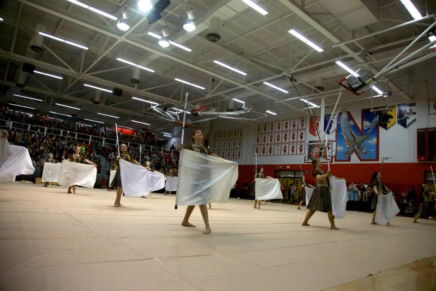 Junior Katie Gucwa stands proudly after completing her routine during the assembly. 