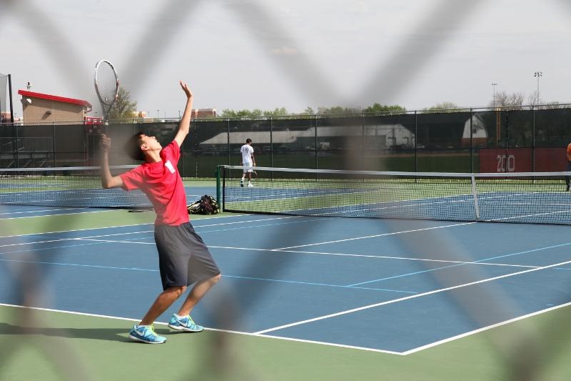 Boys tennis wins last conference match of season