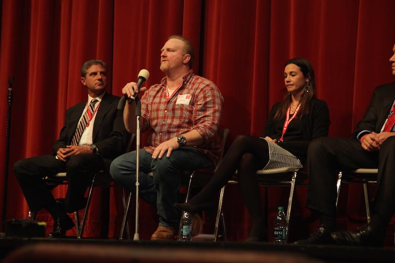 Class of 1984 offensive lineman and discus thrower Carter Hill imparts advice to current Central students