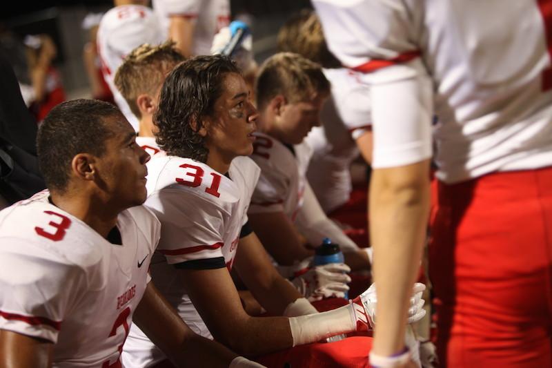 Seniors Peter Villanova and Gabe Soria look on in a team meeting on Sept. 9.