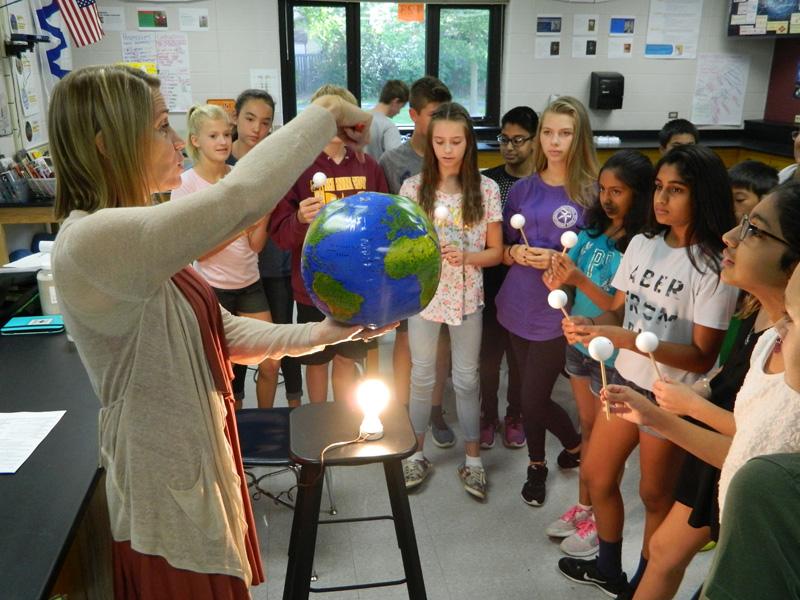 Kennedy students observe a science demonstration.