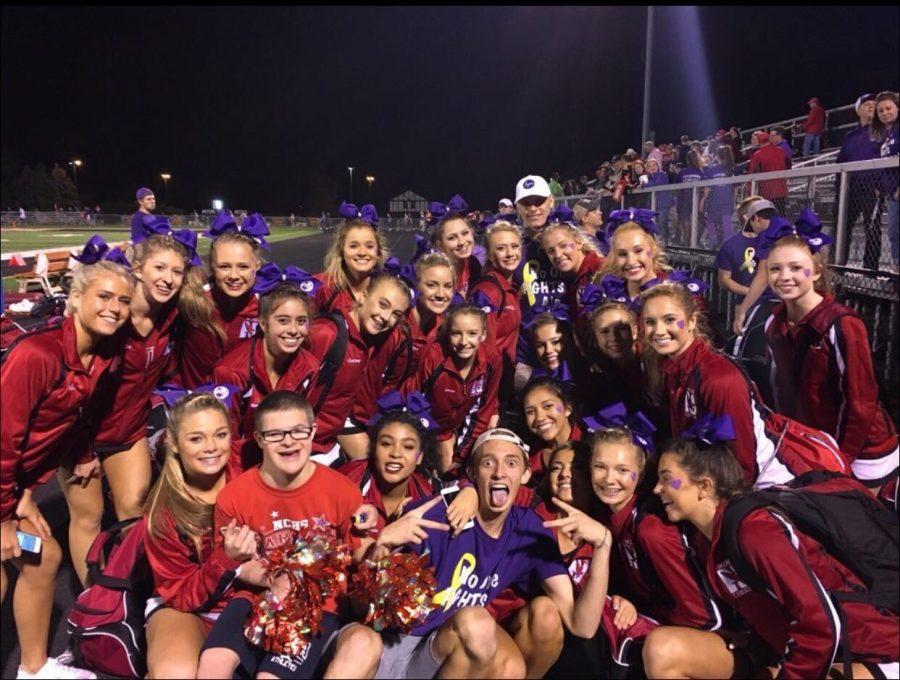 Central cheerleaders and rowdies pose for a photo at the #JWegStrong purple out football game on Sept. 23. "The kindness and genuine love for me that has been shown by so many people from the football team, the golf team, the cheerleaders, the student section, and a lot of the faculty has just been amazing and something that I will never forget and always hold dear to my heart," Justin Wegner said.