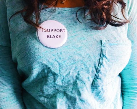In this staged photo, a Central student wears an "I support Blake" pin on her chest. Several students were instructed to remove or hand over the buttons.