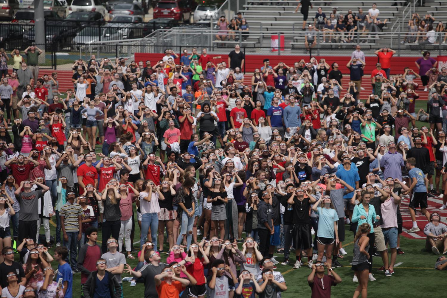 Central students gather on the football field to view the eclipse on Aug. 21.