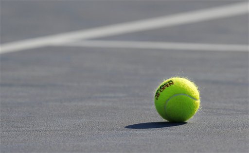 A tennis ball is shown on a court during the third round of play at the 2012 US Open tennis tournament,  Friday, Aug. 31, 2012, in New York. (AP Photo/Paul Bereswill)