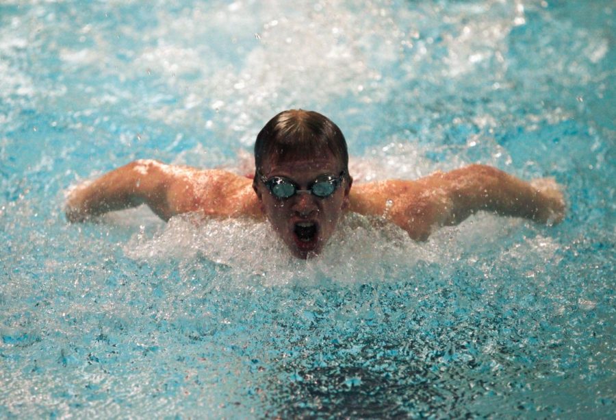 Junior Jonah Klein-Collins completes the fly lap of the 200 IM at the home meet versus Nequa Valley on Dec. 12.