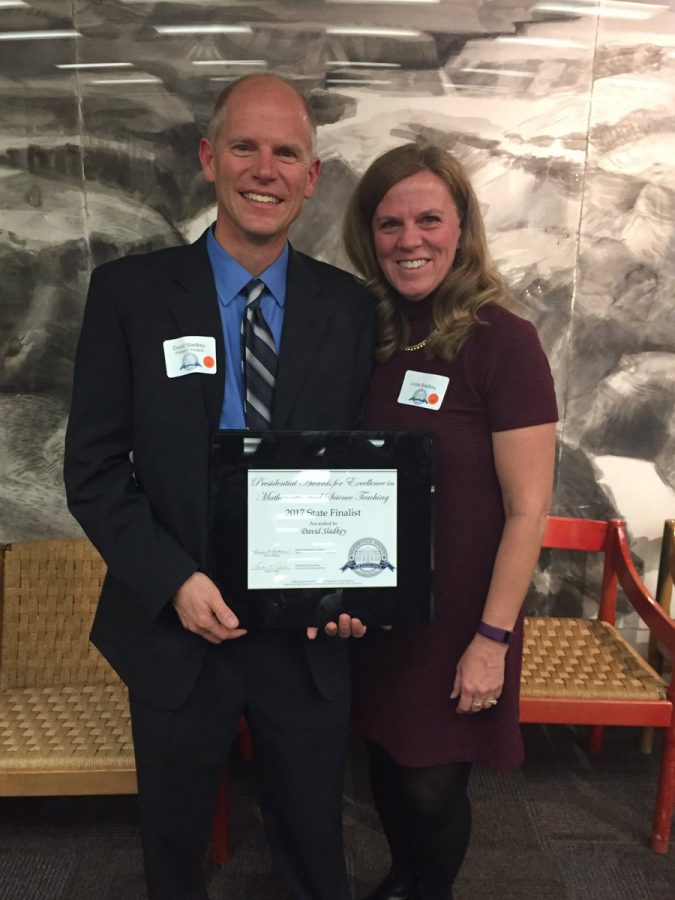 David Sladkey and his wife, Linda Sladkey, pose for a photo after
he was recognized for his excellence in math education at a dinner at Fermilab.