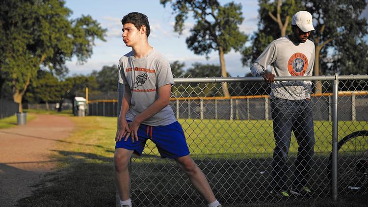 COOLING DOWN: Senior Aaron Holzmueller finishes up a workout at Evanston Township High School.
Holzmueller is requesting that the IHSA create new categories for para-ambulatory runners.
