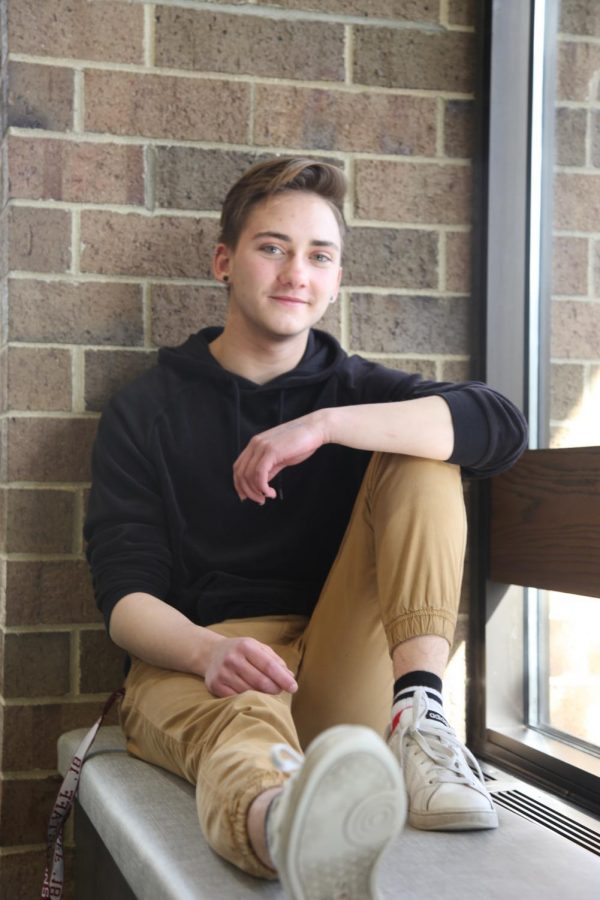 Senior Ralph Davis sits in Nichols Library. Davis is transgender and identifies under the pronouns he,  him, they and them. He stressed the importance of a gender-neutral prom court, highlighting the fact that many LGBTQ youth dont want special treatment. We don’t want an announcement or a ceremony, whatever, we just want it to be low-key and we just want to have the same abilities as other people, Davis said.