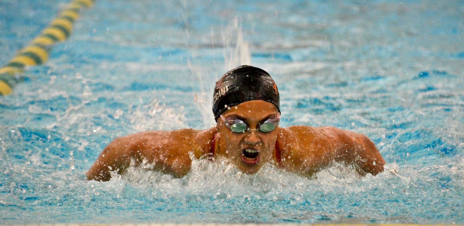 Alexa Puccini swims the 100-yard butterfly on Oct. 11 at Waubonsie Valley.