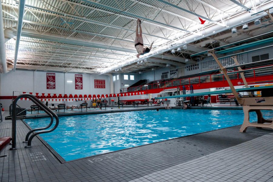 Freshman Luke Wehrli performs a front flip with a one-half twist during practice on Dec. 6. 