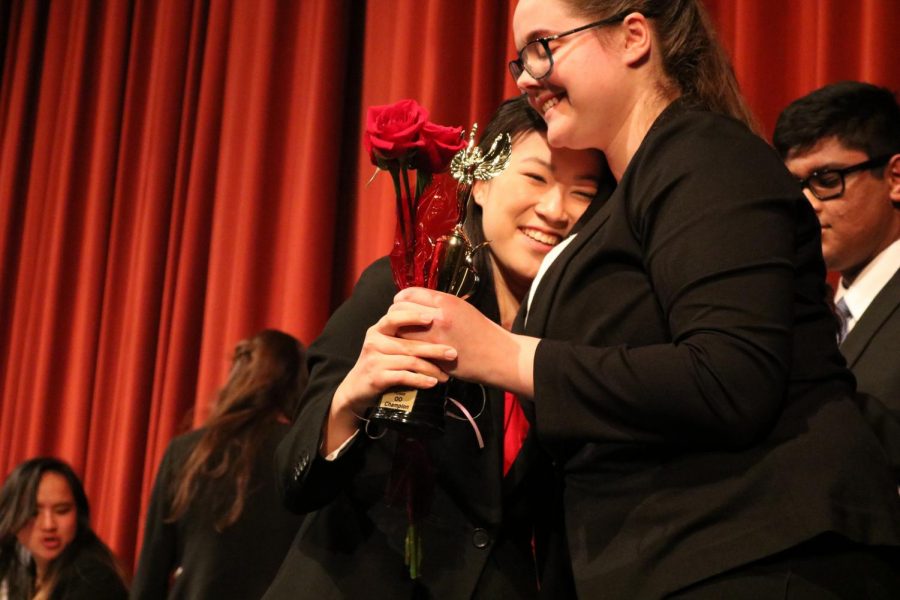 Junior Michelle Kee is presented with an award and rose after winning first place in Original Oratory during the Tournament of Roses on Dec. 8.