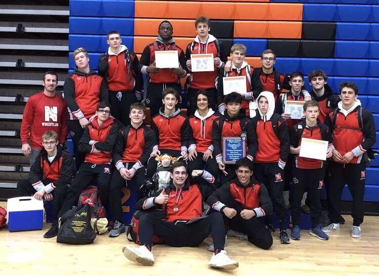 The boys wrestling team after competing at Hoffman Estates on Dec. 14 (left to right, bottom to top): Senior Cameron Palmer, junior Tariq Sikander, freshman Aiden Lutz, sophomores Ethan Jones, Shane Roth, junior Leo Keating, sophomore Anthony Pendolino, juniors Elrin Esporlas, Tyler Driessens, freshman Tommy Porter, senior Jackson Punzel, coach Noah Fitzenreider, juniors Carson Enfield, Sean King, Angelo Eklou, Ryan Silva, senior Kyle Guttosch, junior Stanley Kaszuba, seniors Colin Baumgartner, Ben Cianchetti.
