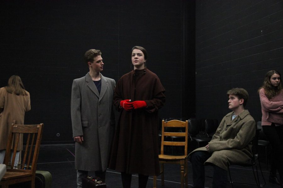 Seniors Payton Nesci, Nora Lullo and Ethan Smith rehearse in the black box theatre for the Holocaust drama “The Diary of Anne Frank.” - Photo by Madeleine Chan
