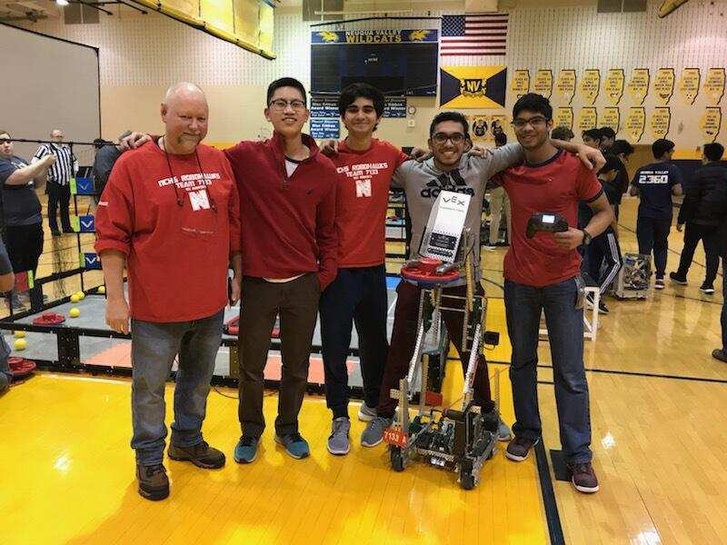 Naperville Central’s robotic team advances on to worlds with their robot, Robohawks A. Left to right: Faculty sponsor Flint Collier and junors Kevin Chen, Kiran Kasbekar, Setul Parekh and Aniketh Rayudu.
