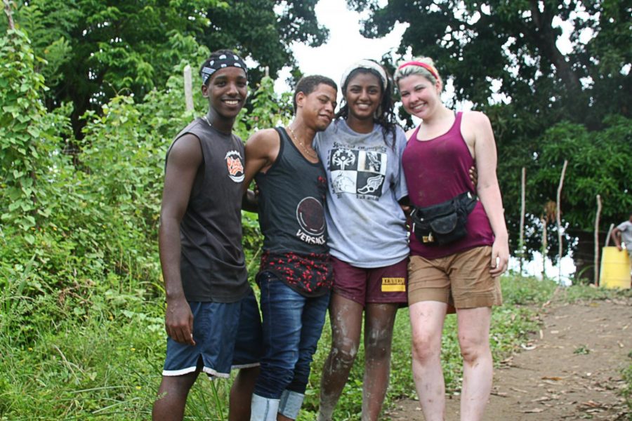 Poola (second from right) volunteering with locals in the Dominican Republic in 2017. “The purpose [of volunteering] is not to go there and take pictures with the kids or to feel like you’re better than them in some sort of way,” Poola said. “You really want to break down that Western savior complex and go in to change your own perspective and mind.”