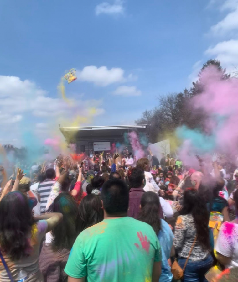 Locals came together and threw colored powder at the Holi celebration in Centennial Park on April 6.