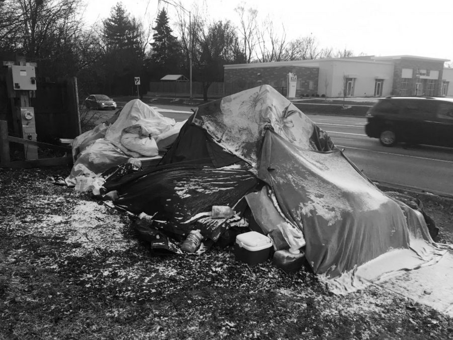 Naperville resident Scott Huber lives in a tent and under tarps the corner of Ogden Avenue and Naperville Boulevard. Huber has been protesting Naperville taxes for about 18 years.