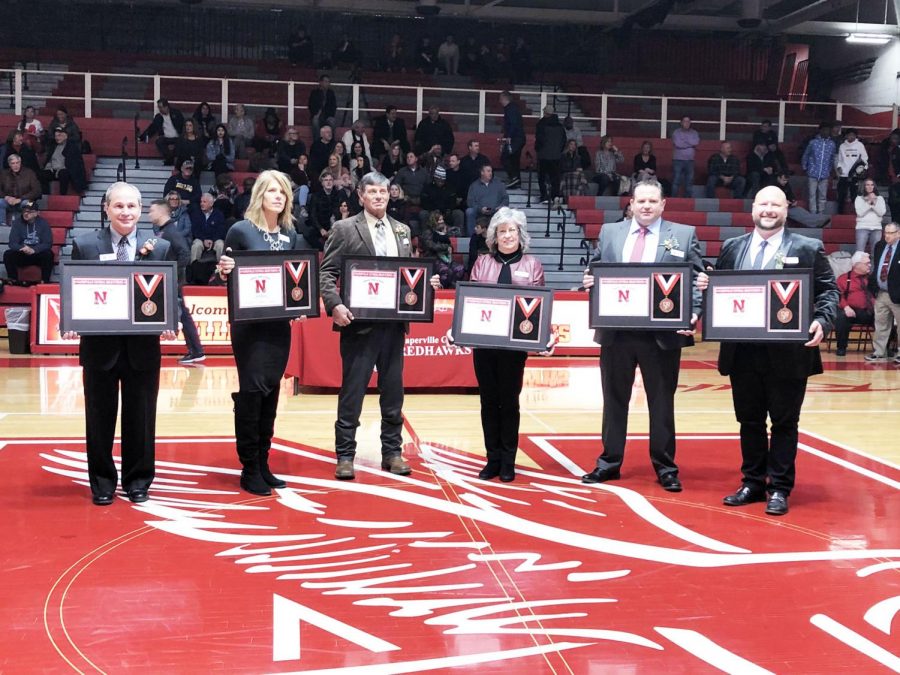 Left to right: Tom Best ('76), Gabrielle Blankenfeld ('86), Randy Kersten ('69), Coach Dottie Rizzuto, Curtis Malm ('96) and Giovanni Rizzo ('98) are honored at the Feb. 14 induction ceremony.