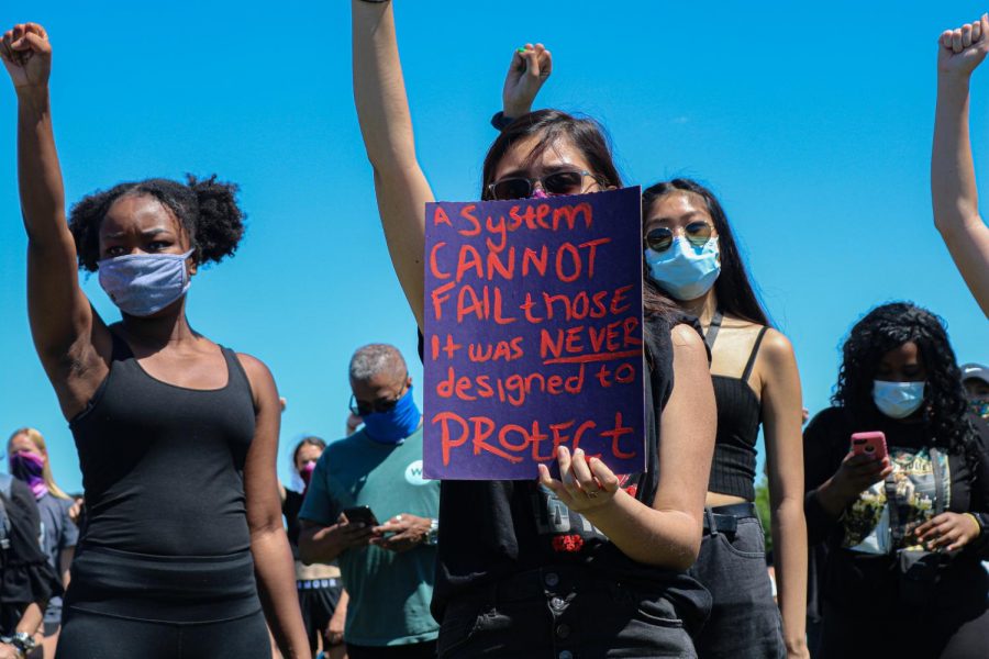 Protesters gathered at Cantore Park in Naperville on May 31 to remember George Floyd, a recently killed black man, and decry systemic racism.