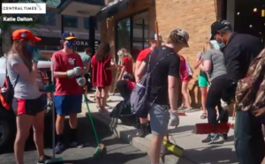 Naperville residents, including many high school students, assist with cleanup the morning after protests turned violent and over 30 city businesses were vandalized.