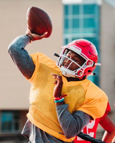 Senior quarterback Sam Jackson looks to make a pass at practice.