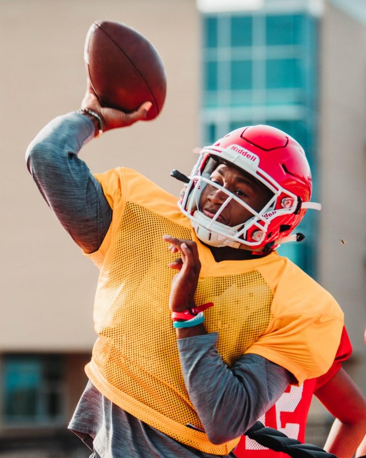 Senior quarterback Sam Jackson looks to make a pass at practice.
