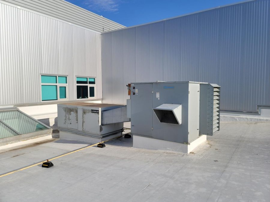 Modular energy exchange units across the roof of the building, like the one pictured above, are responsible for filtering and climate control in different areas of the school.