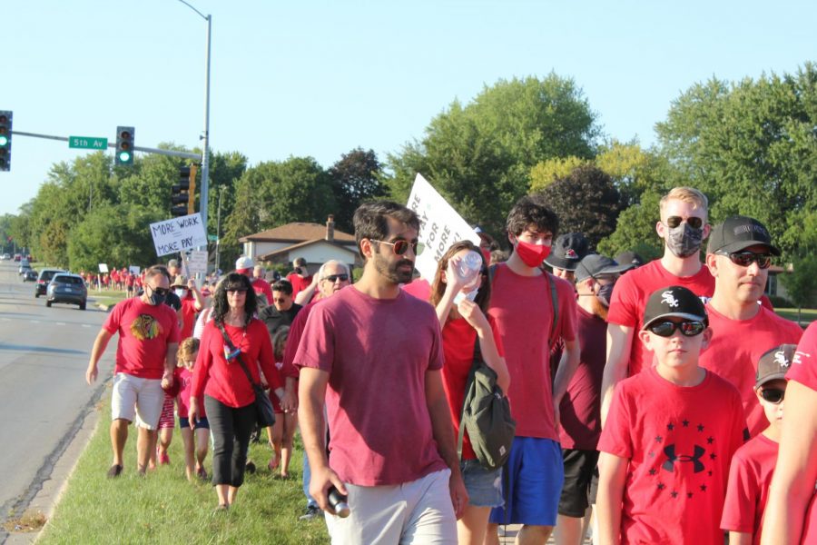 Educators, students and parents march from Naperville North to Washington Junior High in support of the NUEAs contract proposal on Aug. 16