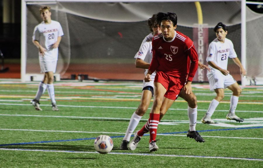 Naperville Central junior forward Nathan Kwon passes to a teammate.