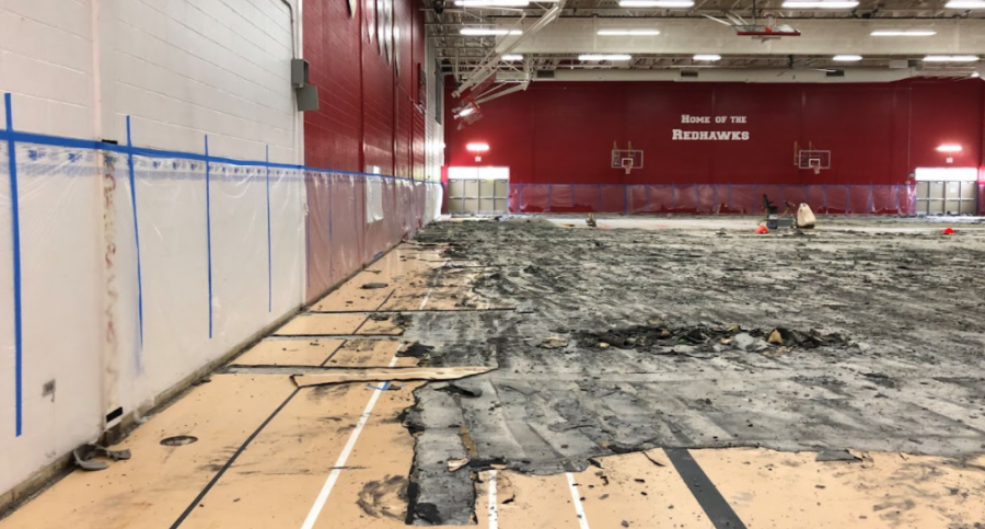 The removal of the original field house floor exposed sticky, black substance described as "bubblegum."
