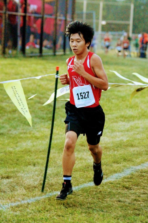 Sophomore Timothy Chan runs in the boys freshman/sophomore race at the 2021 Naperville North Twilight Invitational. 