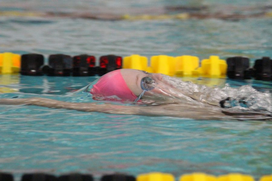 Girls swim ends on a good stroke