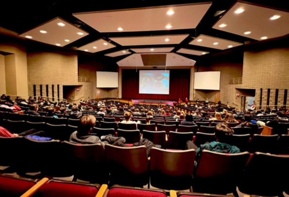 Eight graders listen to a presentation about course selections given by counselors as part of a new program to introduce Central to future freshmen.