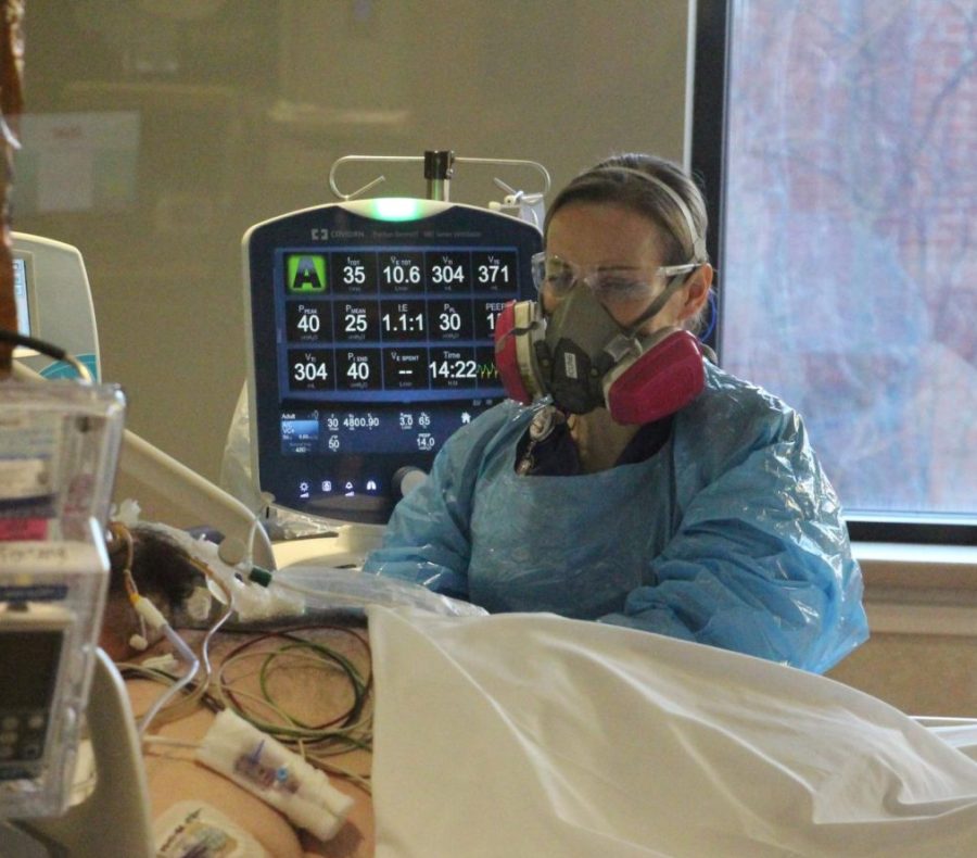 Jennifer Piloni, a nurse in Edward Hospital’s Critical Care Unit, cares for a COVID-19 patient. The hospital has opened new facilities to accommodate for the surge. 