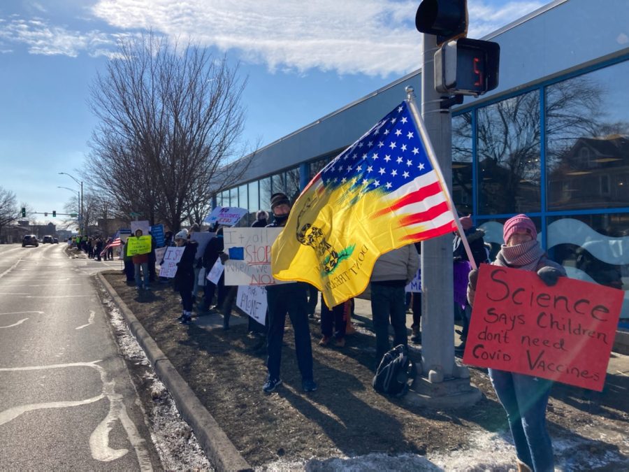 A group of protesters organize outside of DuPage Children’s Museum on 301 N. Washington St. on Jan. 22 to rally against the museum’s new vaccination mandate. 