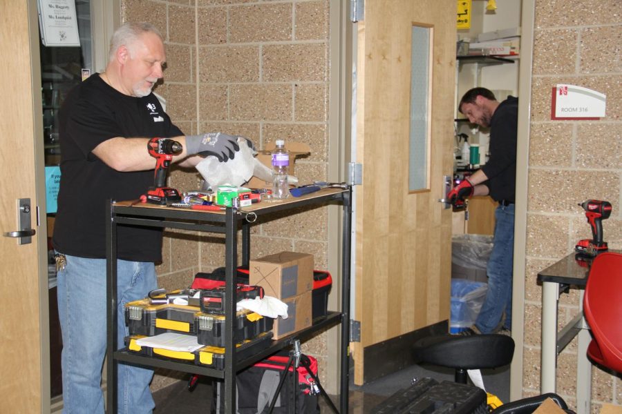 Locks for all rooms, such as Room 316, at Naperville Central are being upgraded. The new locks can be secured without a key and display whether they are locked or unlocked.