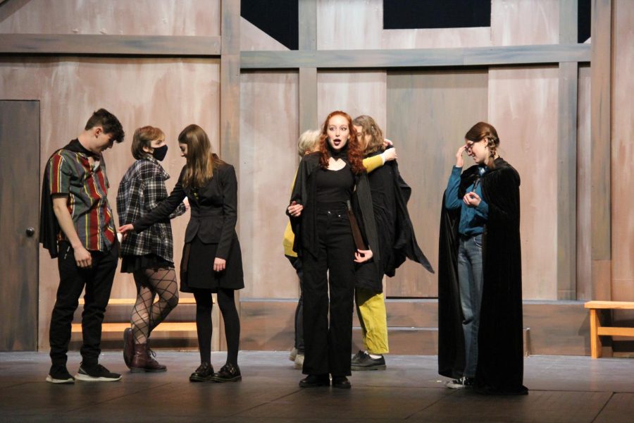 Members of the "Puffs" cast test their mics during a tech rehearsal on March 1.