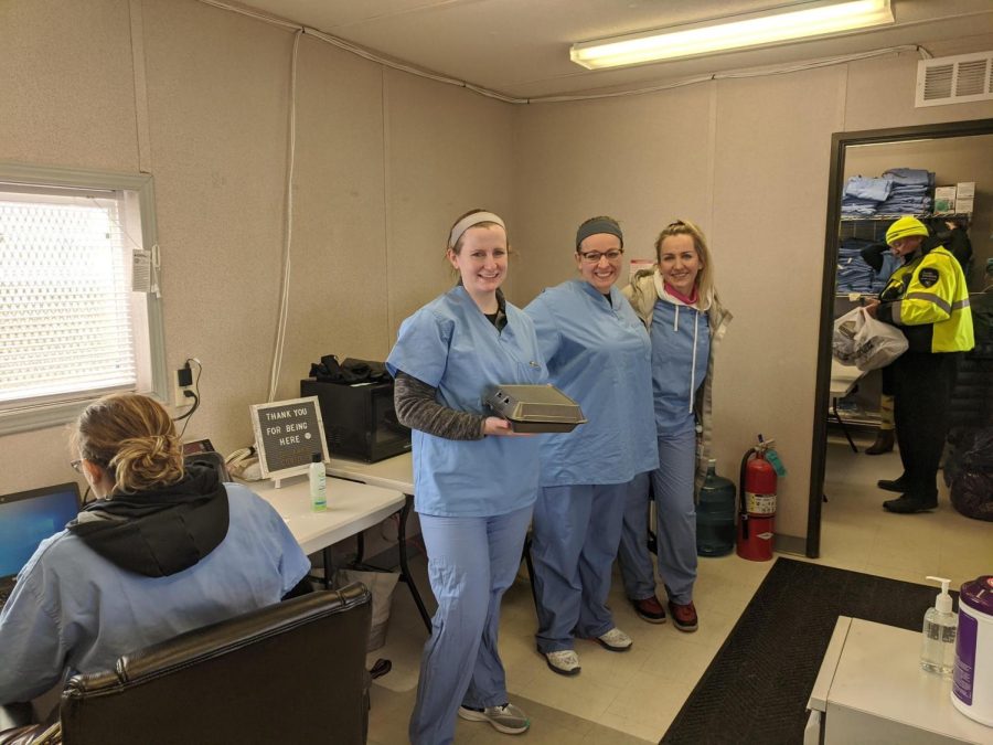 Nurses at a Warrenville drive-thru testing site receive snack donations from Naperville Helps! in March 2020.