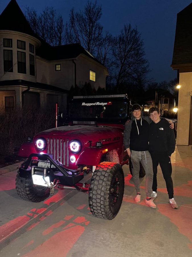 Tristan Hanford (left), and Will Fiedler (right) pose next to their 1974 Jeep CJ5 nicknamed Tiny.