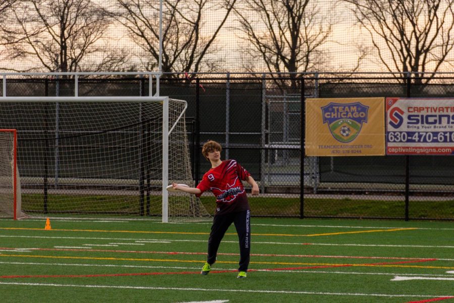 Sophomore Camden Strougal practices throwing a flick at a scrimmage after school in the athletic fields of Knock Park.