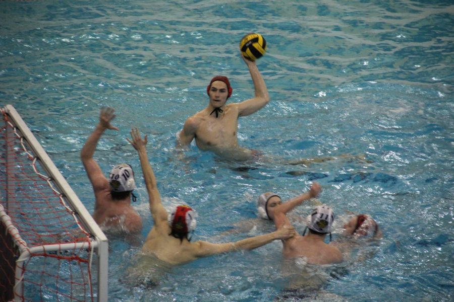 Senior Dawson Strong scores Central's 11th point of the game in their 17-3 sectional quarterfinal win over Neuqua Valley on May 10. 