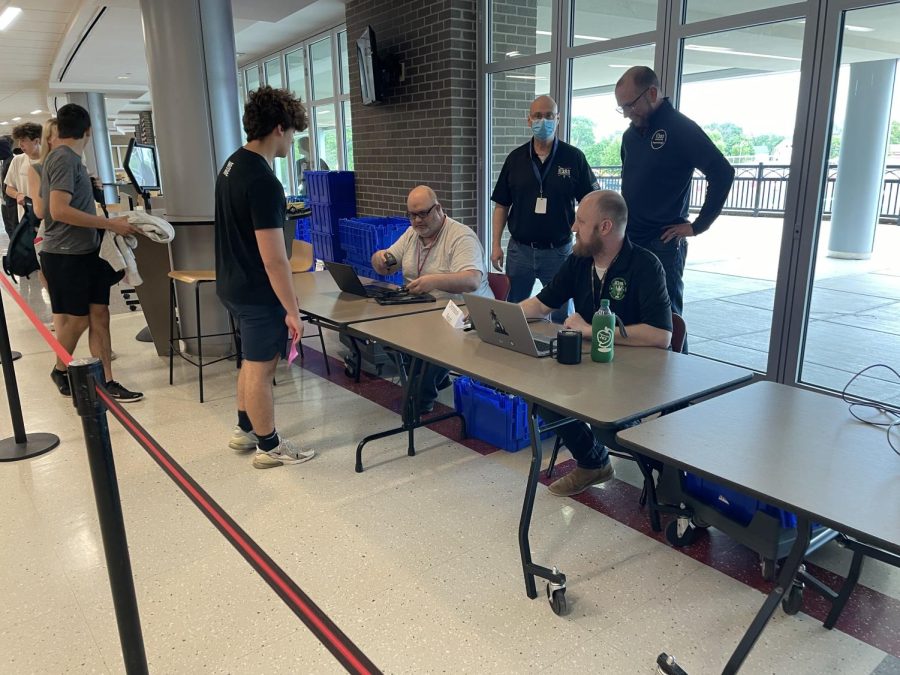 A Naperville Central Student returns his Chromebook at the end of the 2021-2022 school year. 
