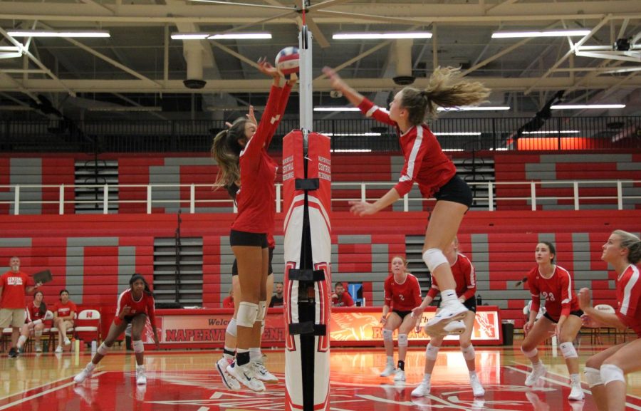Senior Luka Vetaite spikes the volleyball down while senior Lana Rodriguez goes up for the block in the Red and White varsity girls volleyball scrimmage.