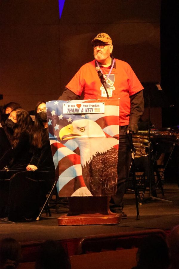 Army veteran Charlie Vladika addresses the auditorium at Centrals Veterans Day Assembly on Nov. 10.