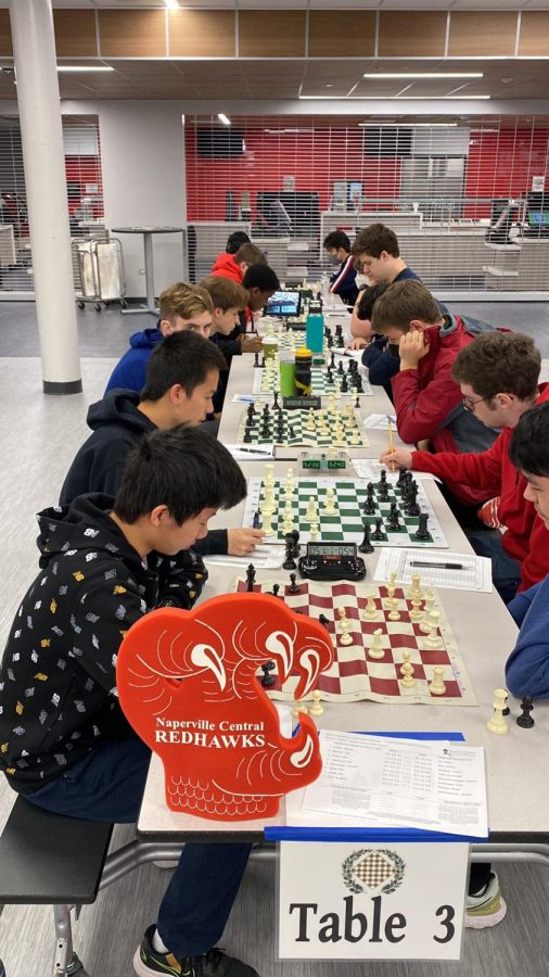 Arthur Xu competes on the first board against Glenbrook North High School at Hinsdale Central High School on Oct. 15. 