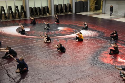 Colorguard team practices routine for their upcoming show on Feb. 5. 