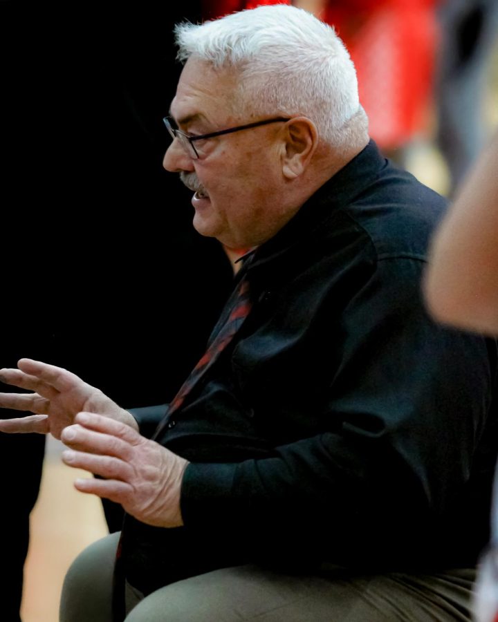 Girls varsity basketball head coach Andy Nussbaum gives his team a pep talk before their game on Nov. 18. He reached 700 wins on Jan. 7. 